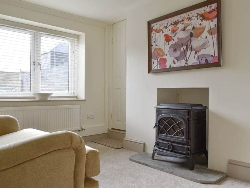 Welcoming living room with wood burner | Millys Nook, St Austell