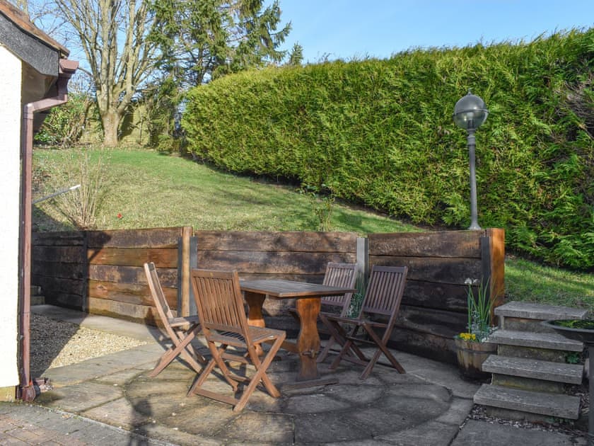 Paved patio area with outdoor furniture | Virginia Lodge, Watchet, near Minehead