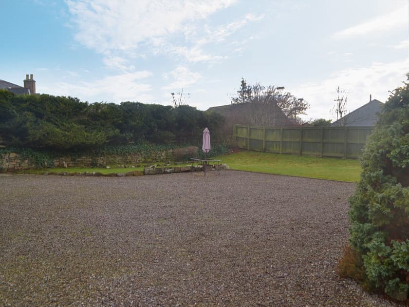 Enclosed lawned garden with sitting-out area, garden furniture and BBQ | Burnside, Dornoch, near Tain