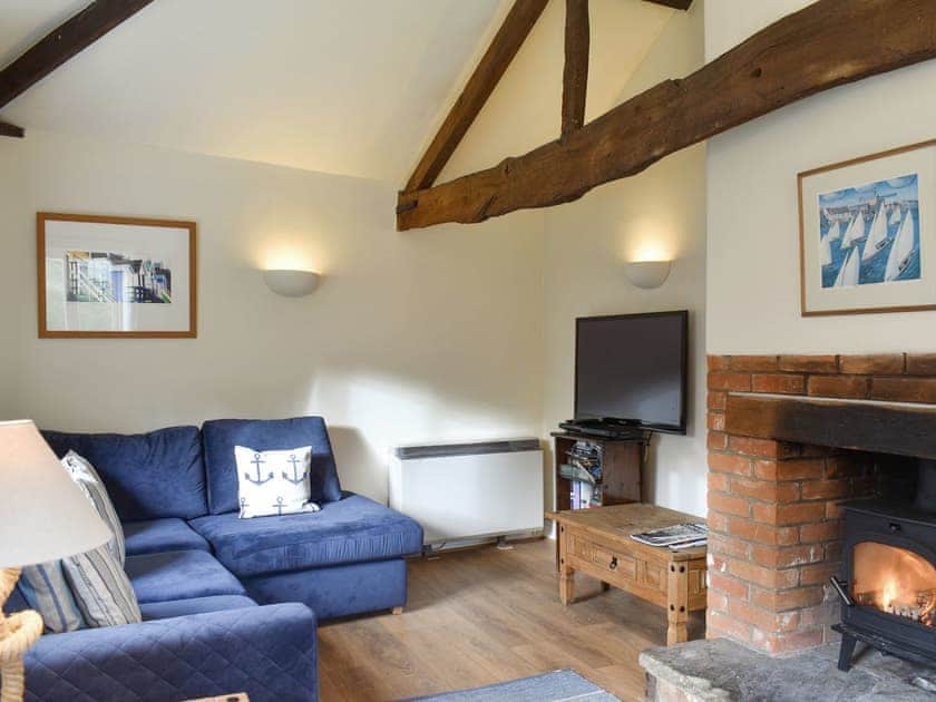 Welcoming living area with wood burner | Manor Cottage, Stiffkey, near Wells-next-the-Sea