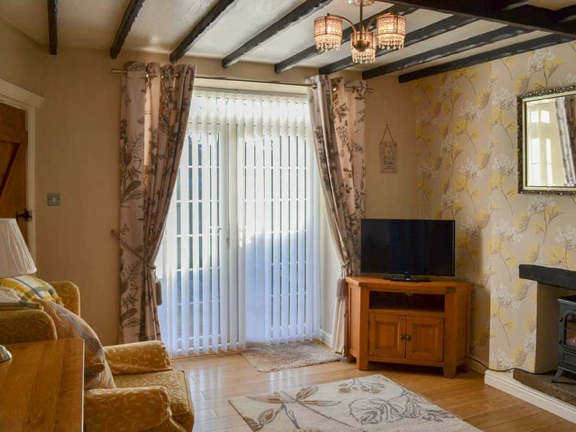 Beamed living room with garden access | Squirrel Cottage, Seamer, near Scarborough