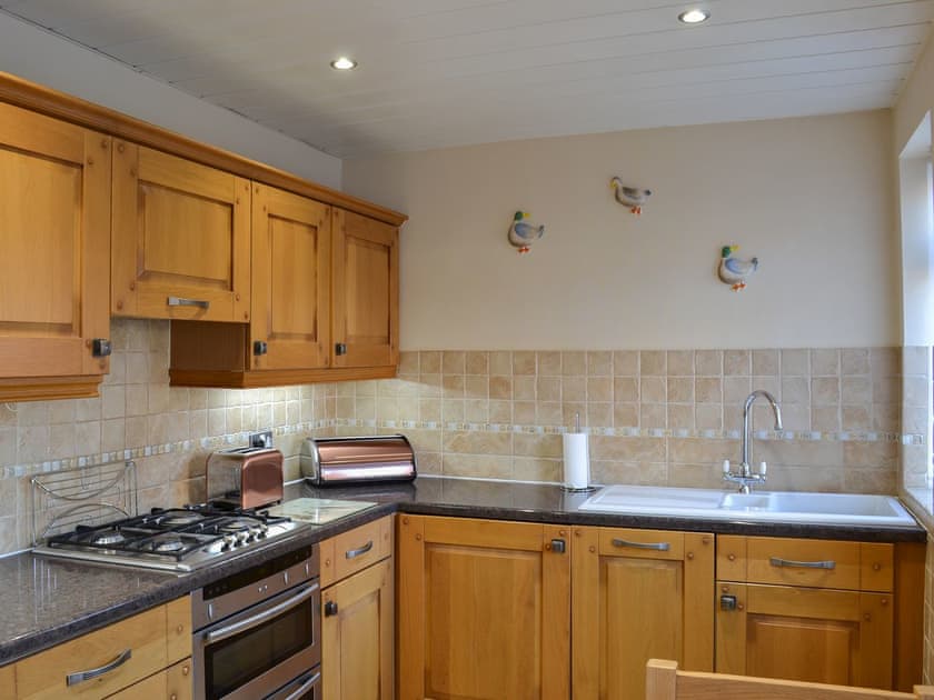 Delightfully half-tiled kitchen | Squirrel Cottage, Seamer, near Scarborough