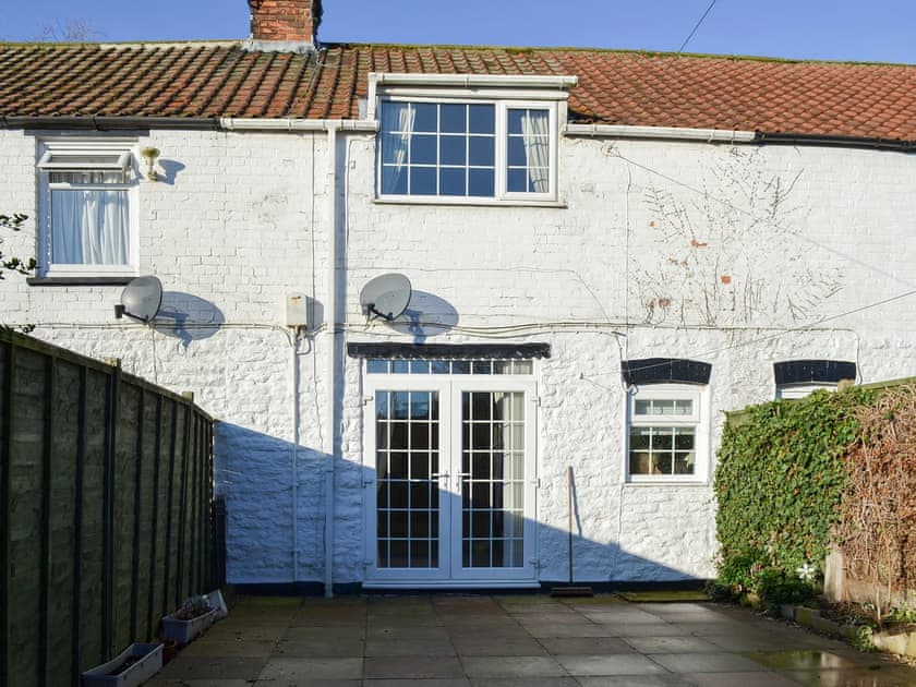 Charming whitewashed holiday cottage with large patio | Squirrel Cottage, Seamer, near Scarborough