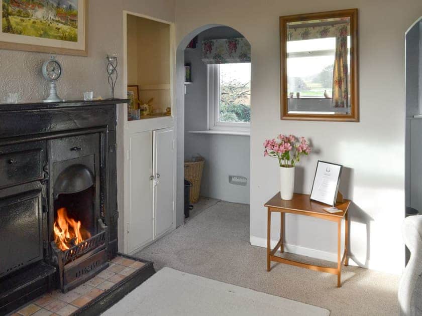 Functional heritage fireplace in living room | Searchlight Cottage, Fraisthorpe, near Bridlington