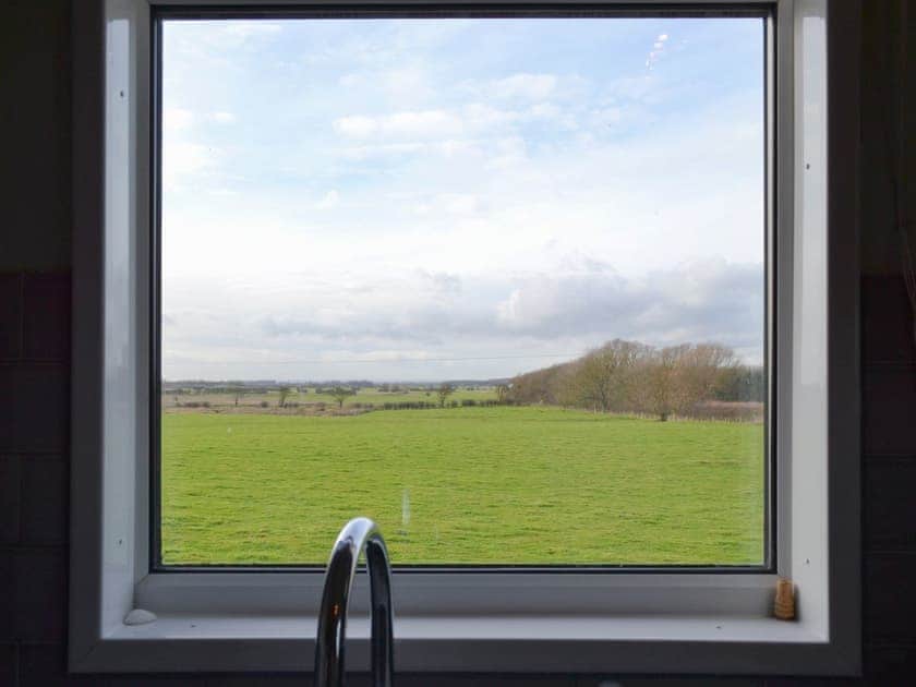 Peaceful rural view from the kitchen | Searchlight Cottage, Fraisthorpe, near Bridlington