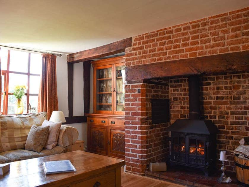 Living room with wood burner | Brushmaker Cottage, Diss