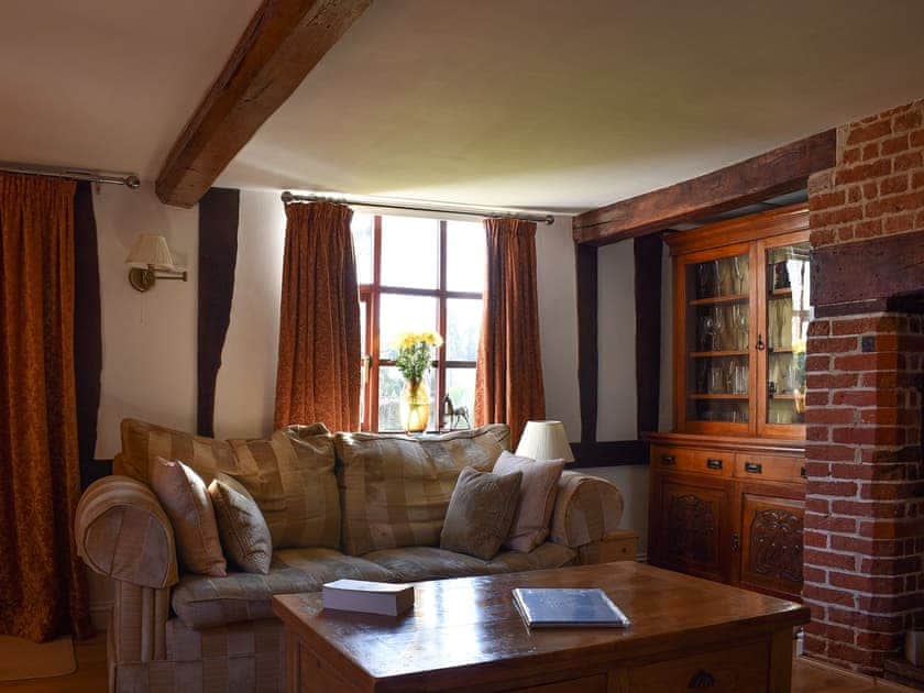 Living room with wood burner | Brushmaker Cottage, Diss