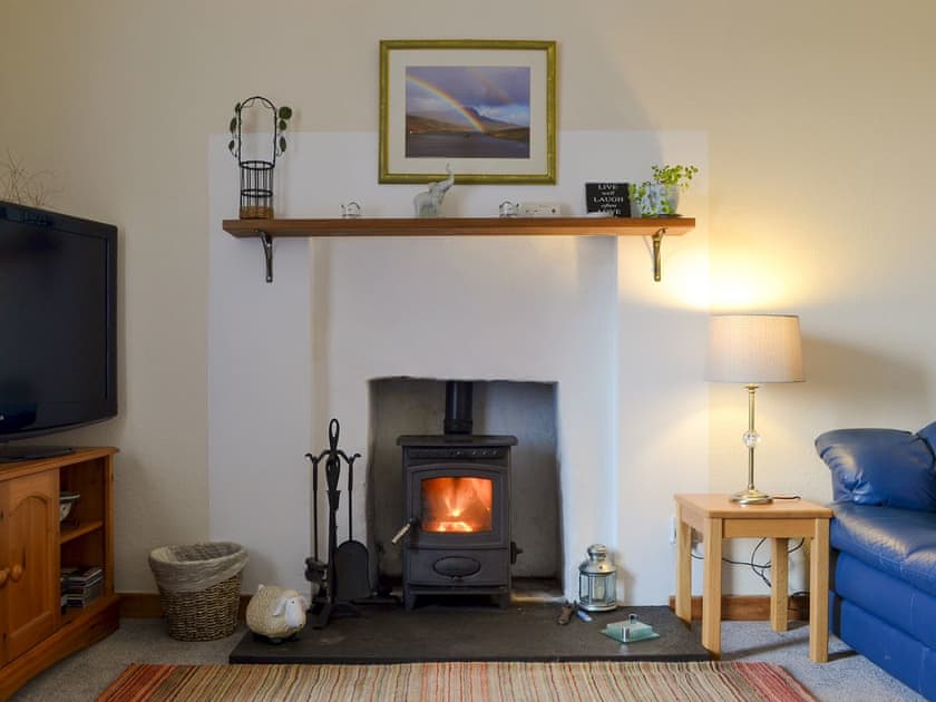 Cosy wood burner in the living room | Tote Cottage, Skeabost Bridge