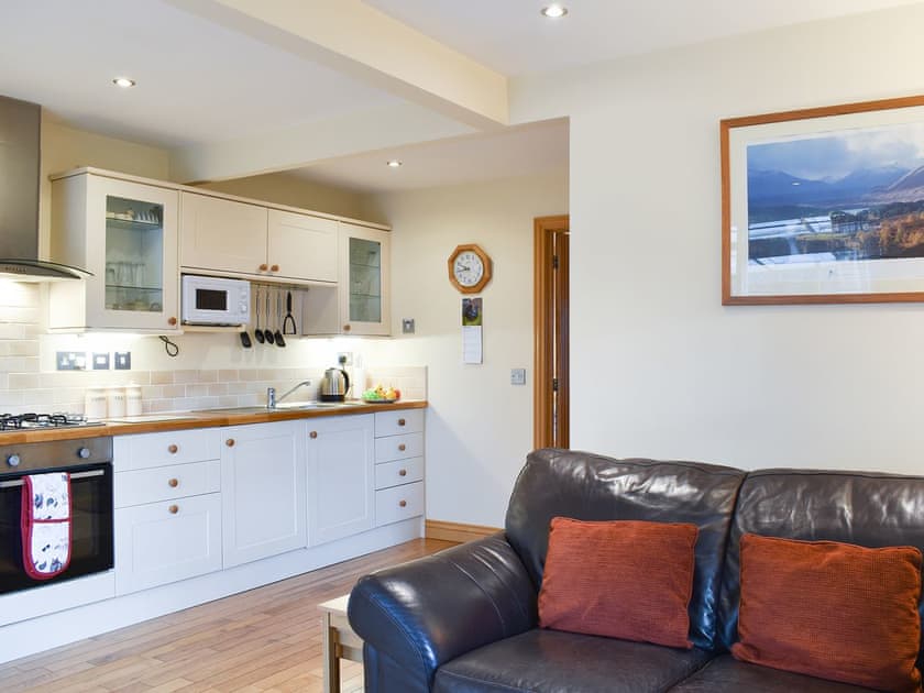 Generous living space with cosy leather furniture | River Cottage - Milton, Drumnadrochit, near Inverness