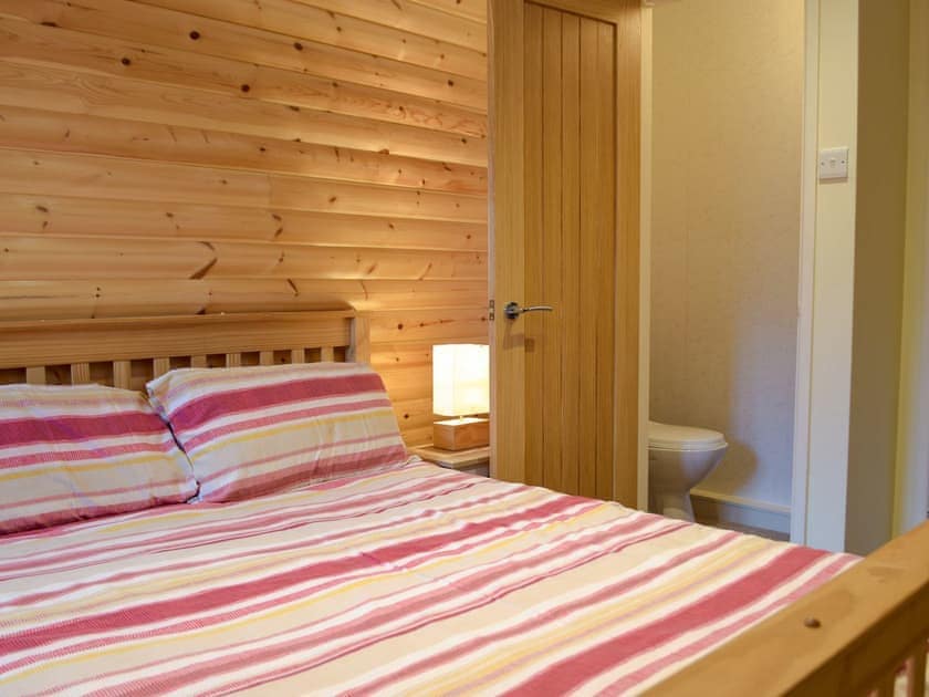 Comfortable double bedroom | Herons Log Cabin, Rosebush