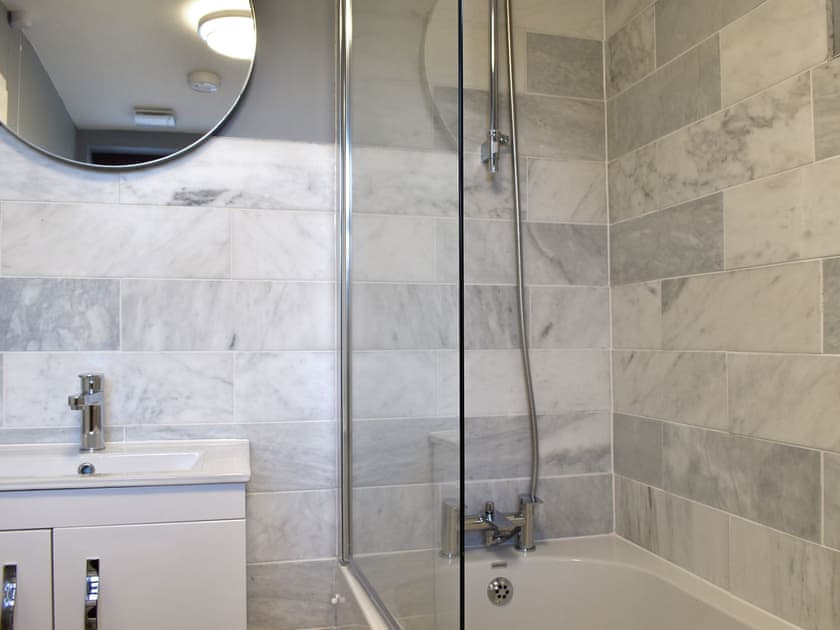 Family bathroom with shower over bath | Salomons Country Cottage, Tunbridge Wells