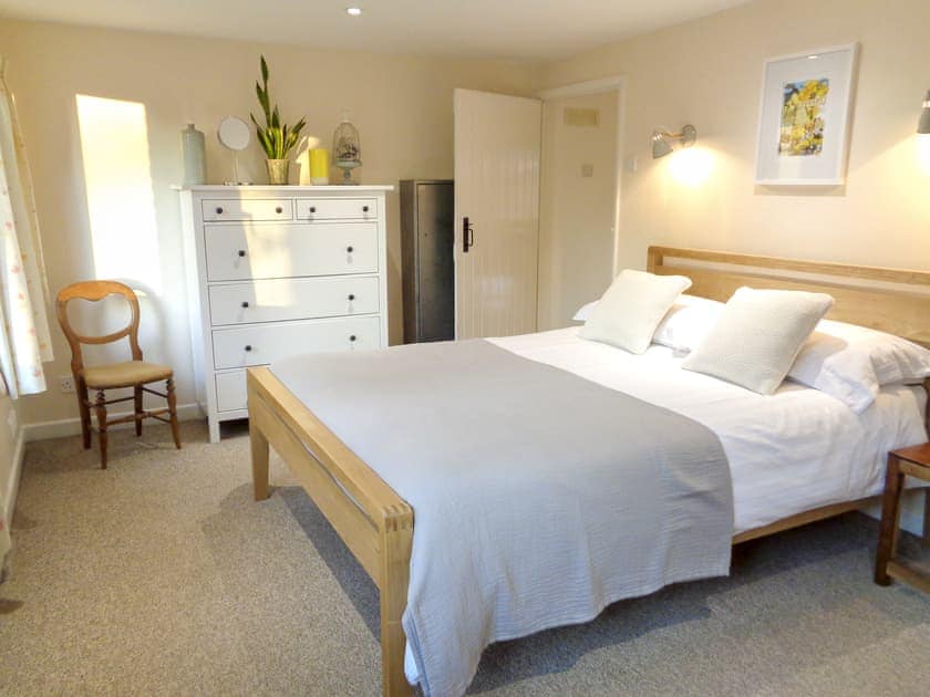 Comfortable king size bedroom with garden views  | The Old Winery Cottage, Newent
