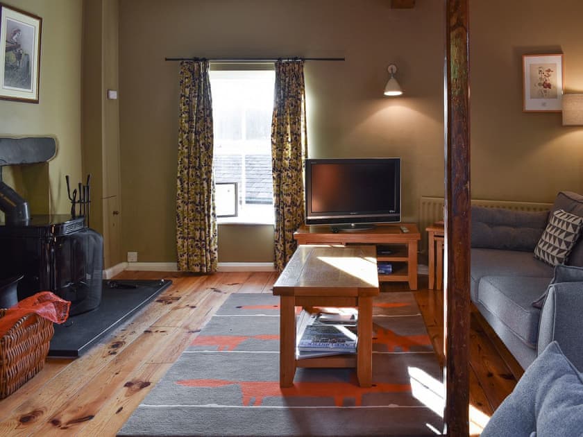 Living room with wood burner | Letterbox Cottage, near Hawkshead