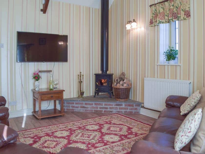 Living room with wood burner | Carthouse Cottage, Cosheston near Pembroke