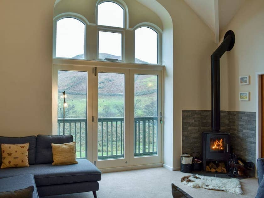 Homely living area with balcony | Howegrain Lodge, Martindale, near Ullswater