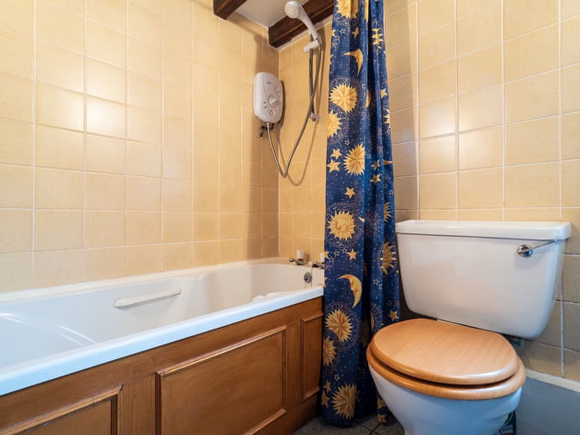 Bathroom with shower over the bath | Buttermilk Cottage - The Old Dairy and Buttermilk Cottage, Youlgreave, near Bakewell