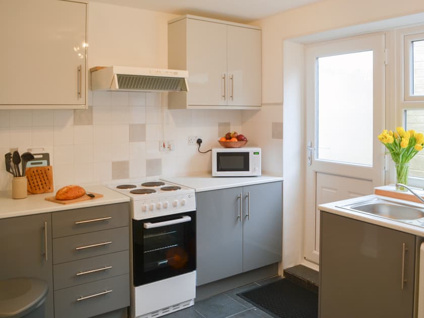 Kitchen with garden access | Broughs House, North Broomhill, near Amble