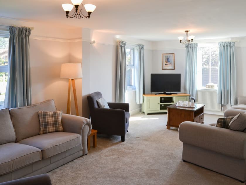 Living room with open fire | Riverside - Norfolk Riverside Cottages, Stalham