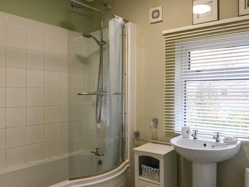 Family bathroom with shower over bath | Riverside House, Beccles