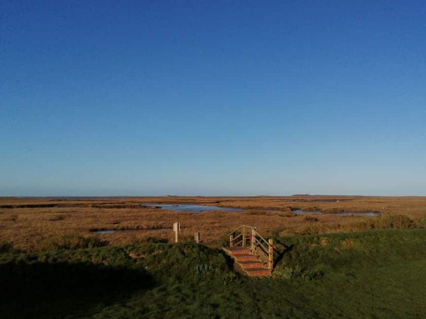Beautiful salt marsh vista from the end of the garden | Dale View, Vista Cottage - Sea Marsh Cottages, Brancaster Staithe, near Wells-next-the-Sea