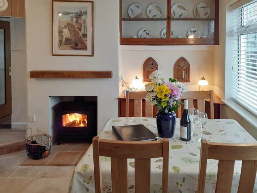 Dining room with wood burner | Trinity Cottage, Wells-next-the-Sea