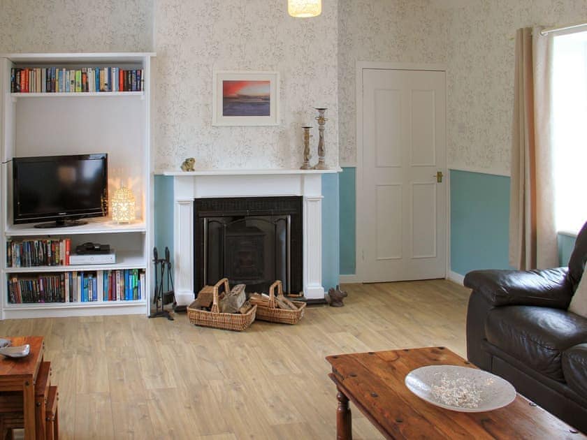 Comfortable living room with wood burning stove | Palmallet Cottage, Whithorn