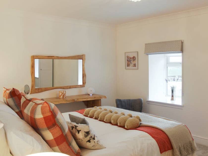 Main bedroom with feature dressing table | Rhunahaorine Cottage, Tayinloan, near Tarbert