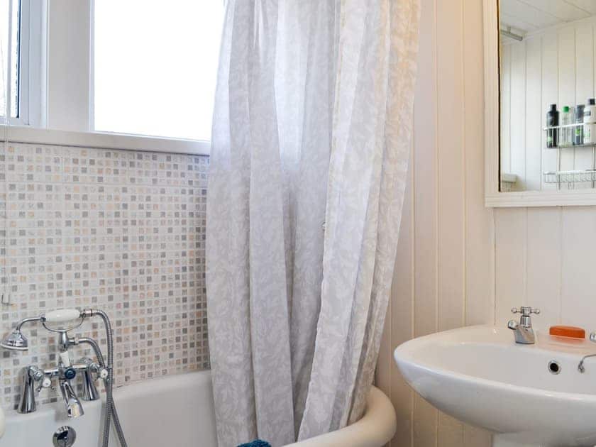 Bathroom with telephone style shower attachment to the roll top bath | Craigclunie, Ballater