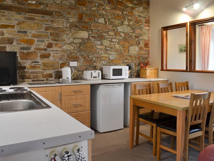 Well-equipped fitted kitchen | Warren Cottage - Stowford Lodge Holiday Cottages, Langtree, near Great Torrington