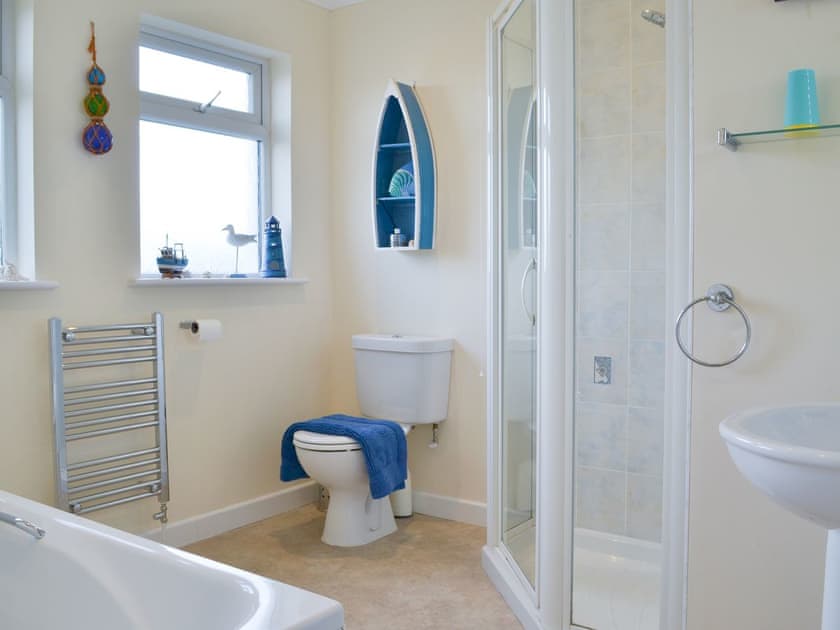 House bathroom with shower cubicle and bath | Driftwood, Port Isaac