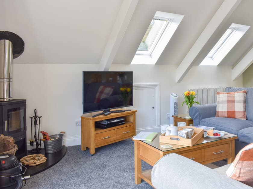 Comfy living area with wood burner | Camellia Cottage - Kilbol Country Cottages, Polmassick, near St Austell