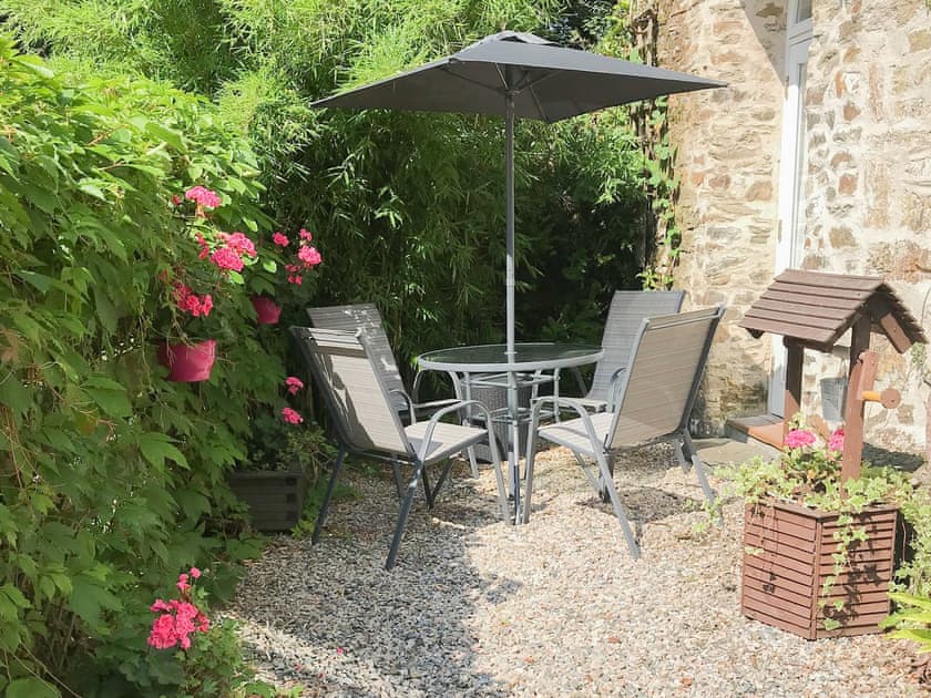 Intimate enclosed garden with seating | Chapel Barn, Bodmin