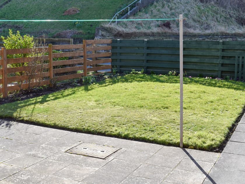 Enclosed patio area with lawned area | Sandstell Point - Sandstell Point Apartments, Spittal, near Berwick-upon-Tweed