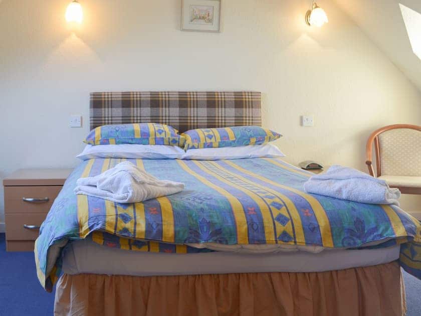 Inviting and relaxing bedroom with double bed | White Gables - Scott Holiday Cottages, Portknockie