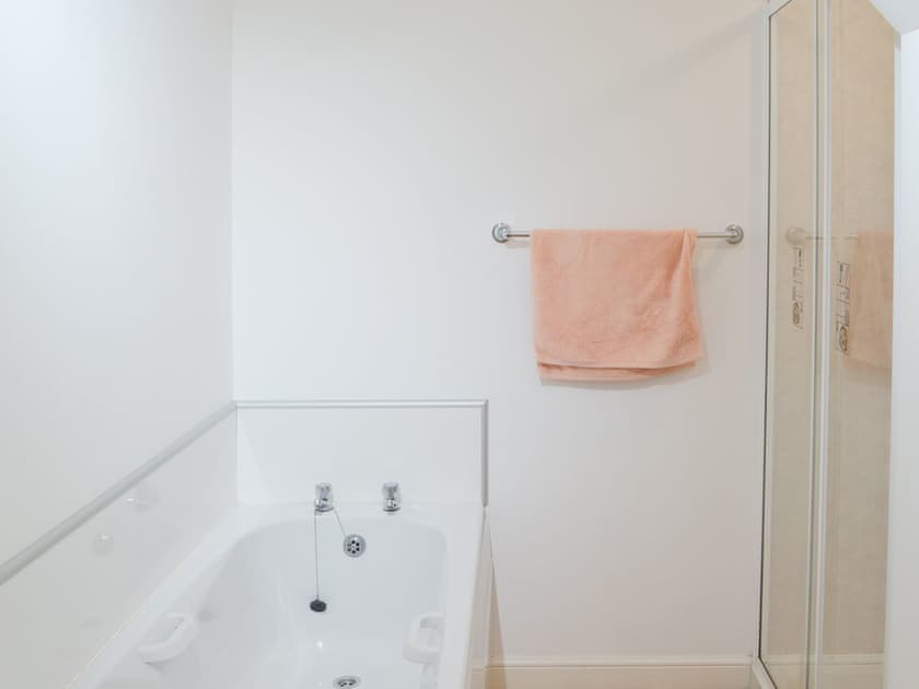 Bathroom with bath and shower cubicle | White Gables - Scott Holiday Cottages, Portknockie