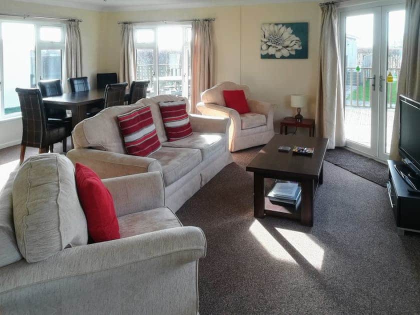 Bright and comfortable living/dining area | Hawks Roost - Yonder Green Lodges, St Ervan, near Padstow