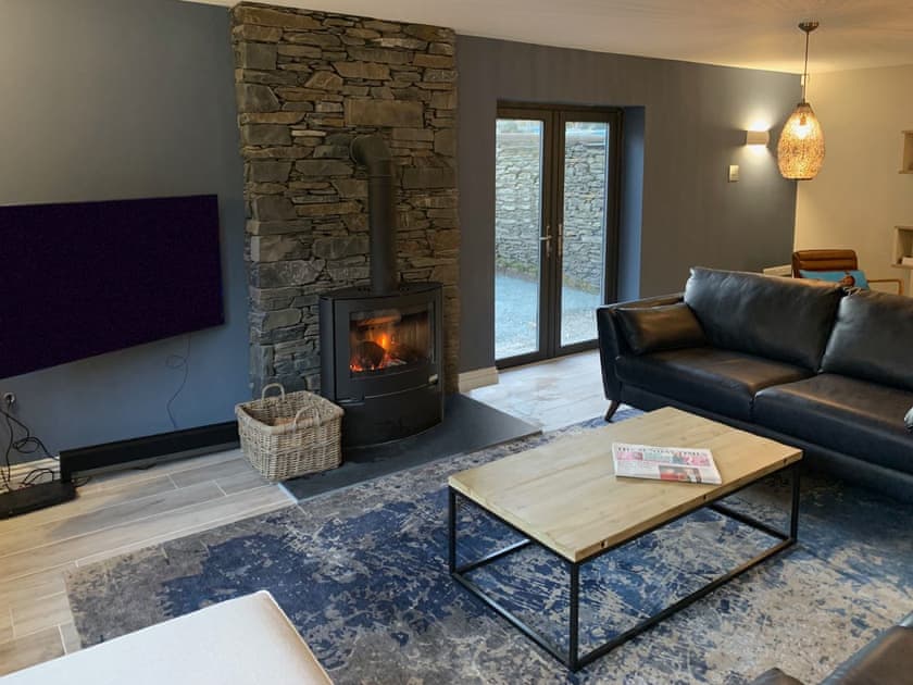 Welcoming living area with wood burner | Cannondale, Annisgarth, near Windermere
