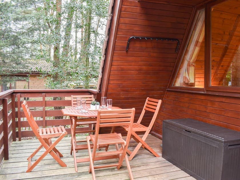 Decked balcony area with outdoor furniture | Bracken Lodge, Weybourne, near Sheringham