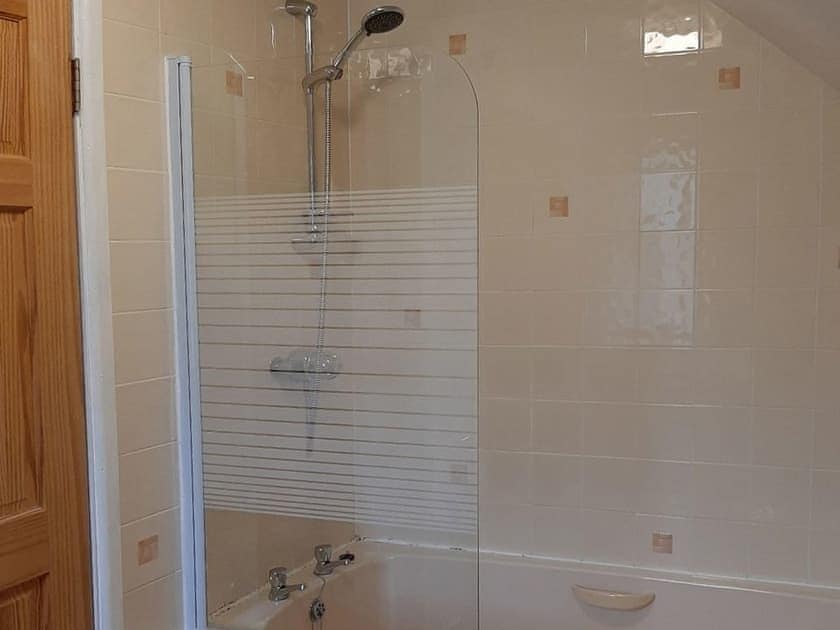 Bathroom with shower over the bath | Forge Cottage - Longmeadow Farm, Shaldon, near Teignmouth