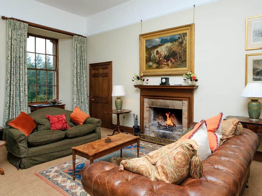 Stunning living room with an open fire | Macduff Tower - Kinnaird Castle, Brechin