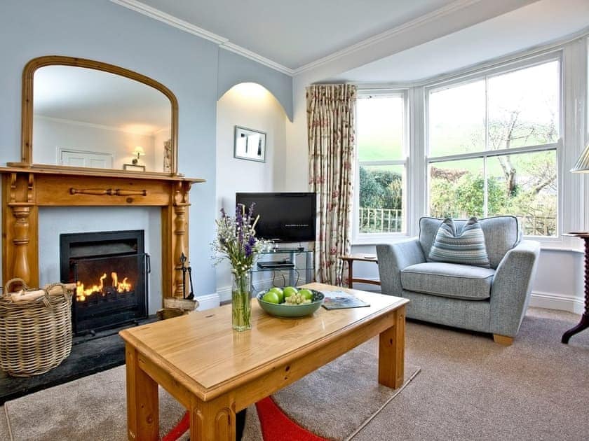 Period-style living room with open fire | Mill Lodge - Tuckenhay Mill, Bow Creek, between Dartmouth and Totnes