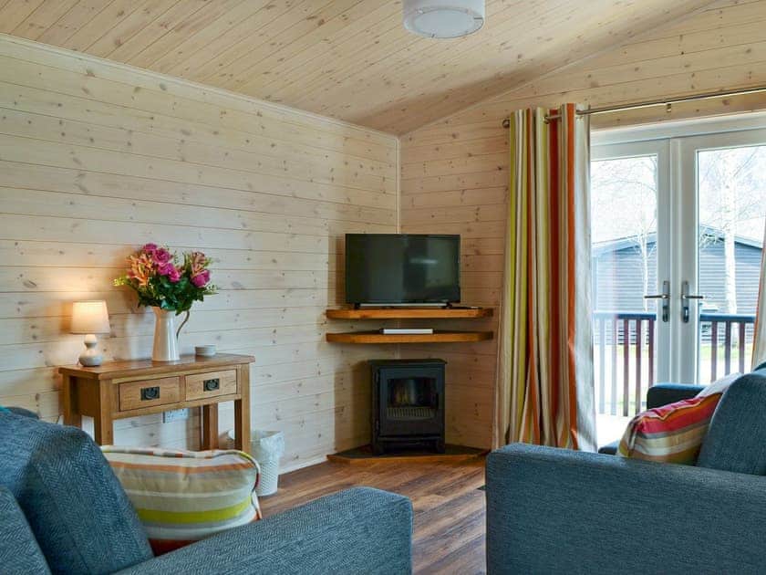 Delightful living area with balcony access | Bransty, Burnside Park