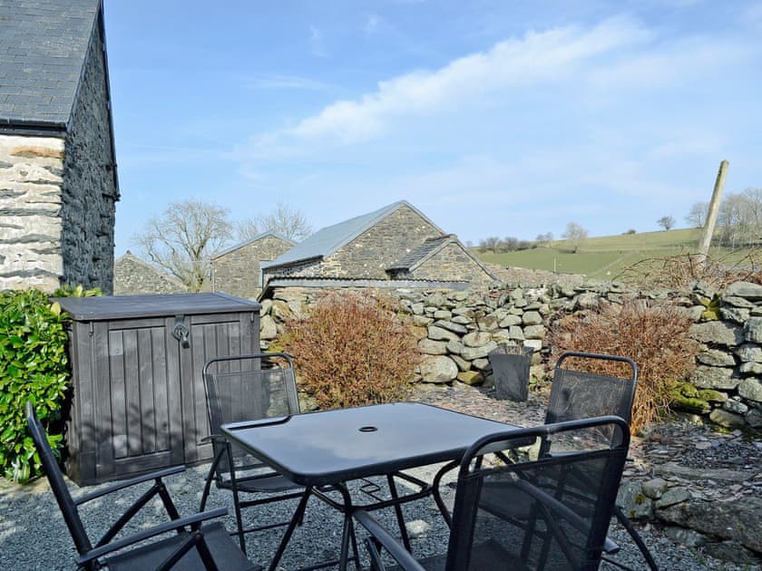 Relaxing enclosed patio with garden furniture  | Castiel Cottage, Ysbyty Ifan, near Betws-y-Coed