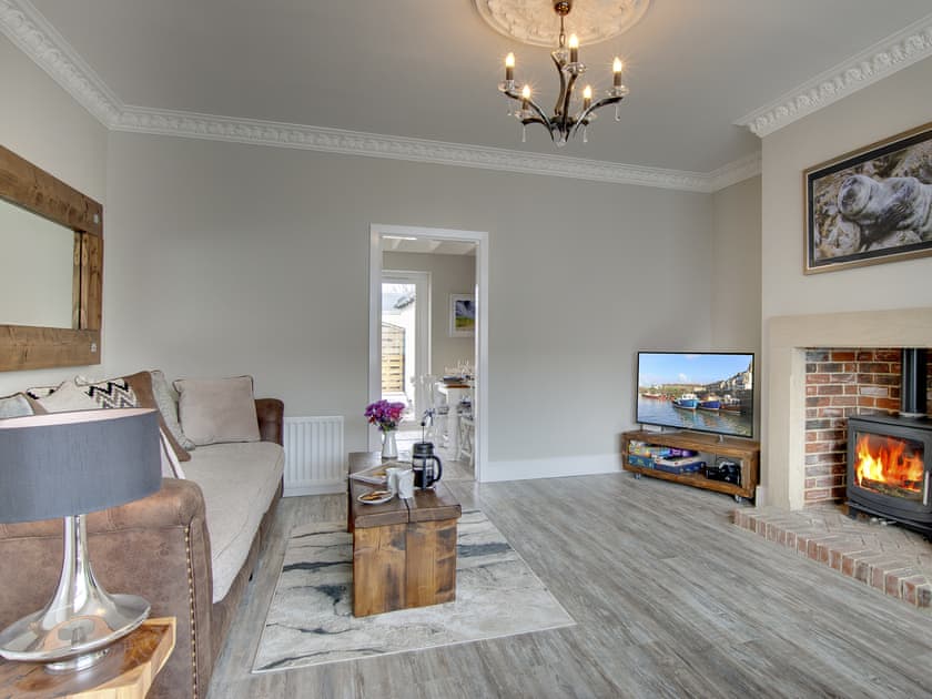 Tastefully furnished living room with wood burner | Amber Waves, Seahouses