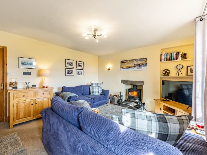 Comfortable living room with wood burner | Carrie’s Gate, Coniston