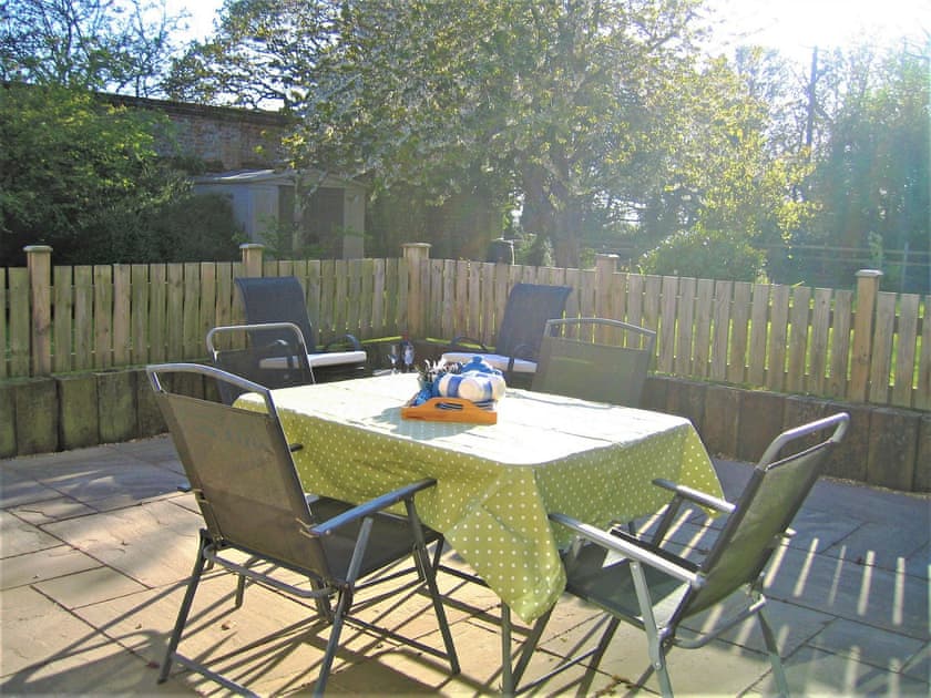 Relaxing patio area | The Granary - White House Farm Holiday Cottages, Knapton, near North Walsham