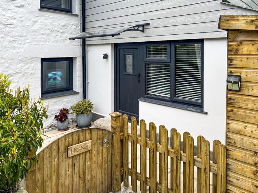 The entrance to The Nest from the gravel driveway. This enclosed area gives privacy and a safe space for guests with dogs too. | The Nest, Lelant Downs, near St Ives