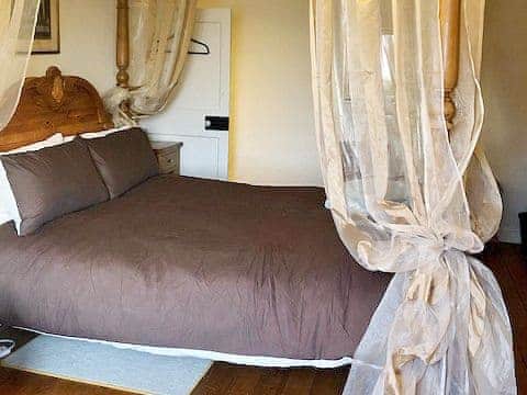 Four Poster bedroom | Ashley Cottage, Colsterworth, near Grantham