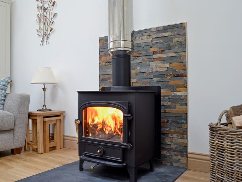 Cosy living area with wood burner | Swallows, Borgue, near Kirkcudbright