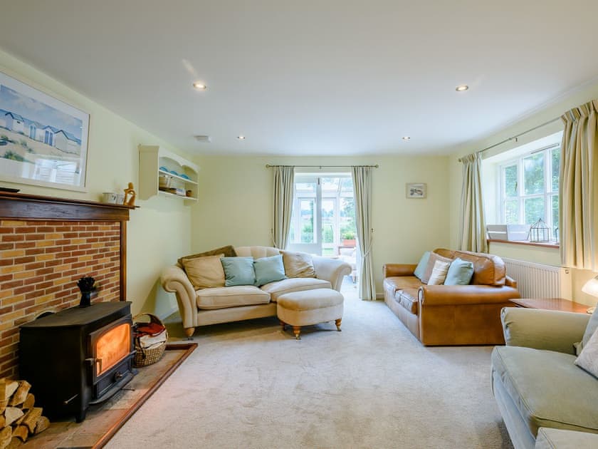 Charming living room with wood burner | Leatherpool Place, Wiveton, near Holt